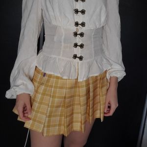 Yellow pleated skirt